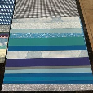 Assorted Blue and Gray Patterned Scrapbook Craft Paper Set.